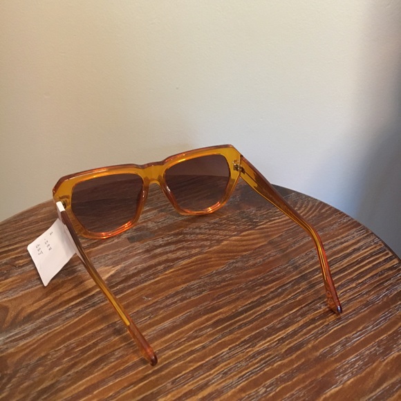 Women’s Shiny Plastic Unique Shape Sunglasses - a new day light orange - Picture 5 of 5